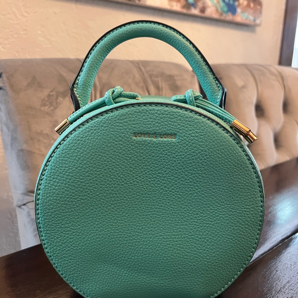 Aqua Blue Mini Bag with Structured Design and Gold Hardware